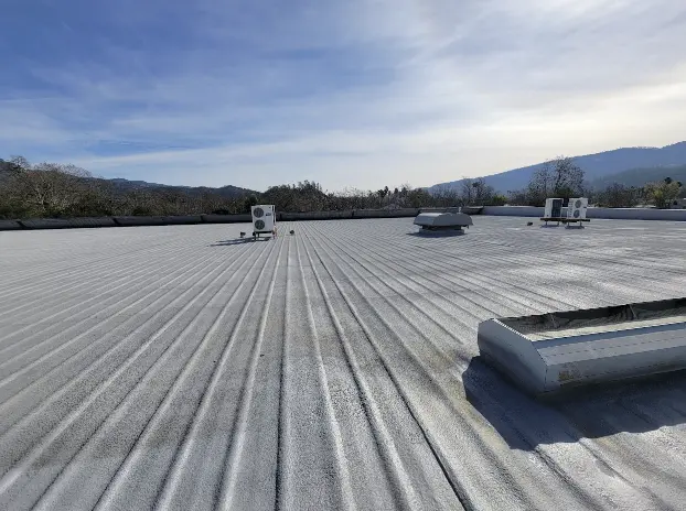 Commercial building roof in San Francisco with spray foam insulation applied, offering thermal protection.

              