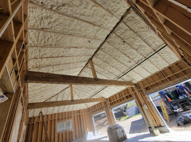 Interior view of a custom home in San Jose with spray foam insulation applied to the ceiling and walls for enhanced energy efficiency.

              