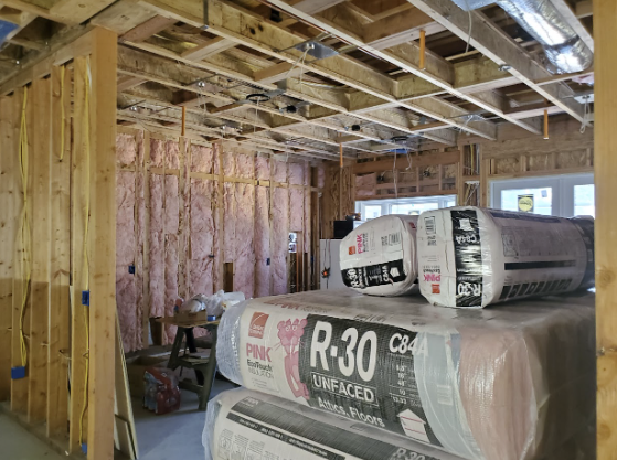    Wine cellar construction site with R-30 fiberglass insulation rolls. 