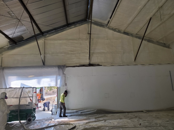  

                     Technicians applying insulation to the walls and ceiling of a commercial building in San Jose.

                     