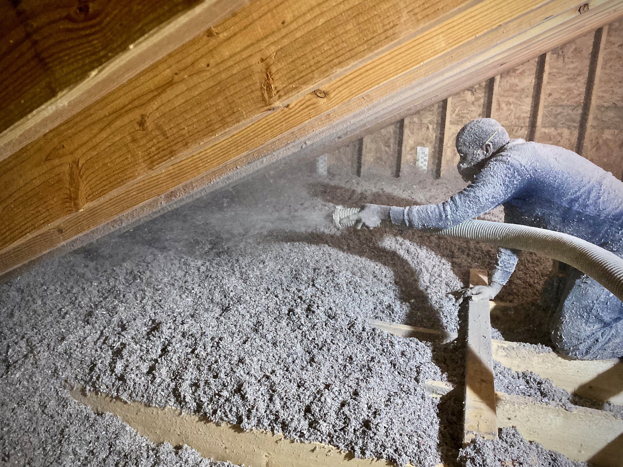  

                  Installation of blown-in cellulose attic insulation.

                  