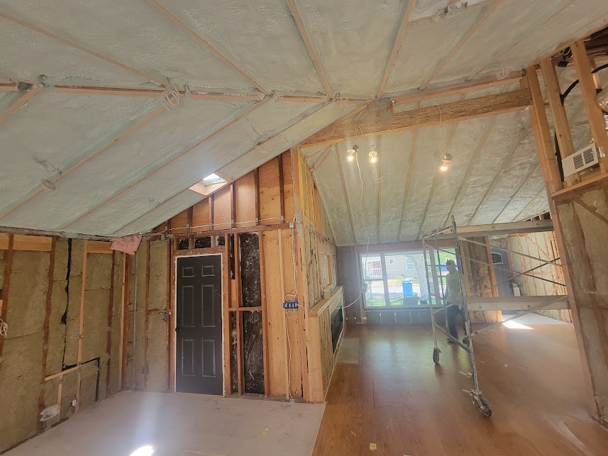  
         
         Spray foam insulation applied on sloped ceilings inside a house.


         