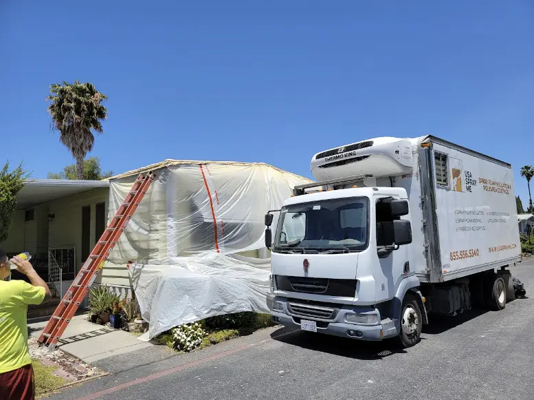 A spray foam insulation truck at a residential site, ensuring homes stay warm in winter and cool in summer.