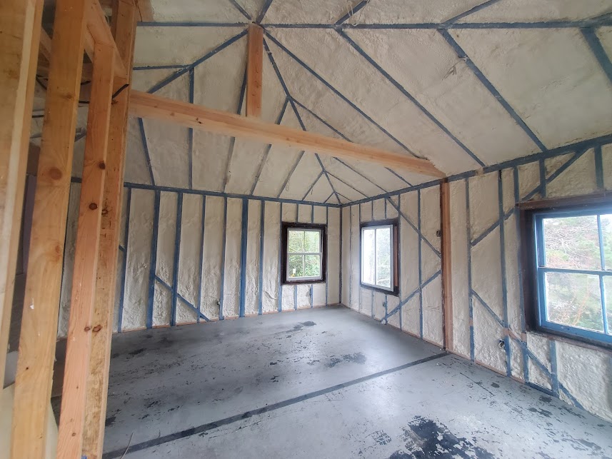  


                     Interior room with spray foam insulation applied to walls and ceiling between framing.





                     