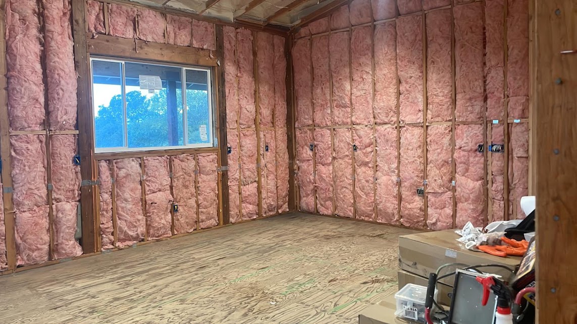  
               Room walls insulated with fiberglass, prepared for interior finishing.



      
      
      
               