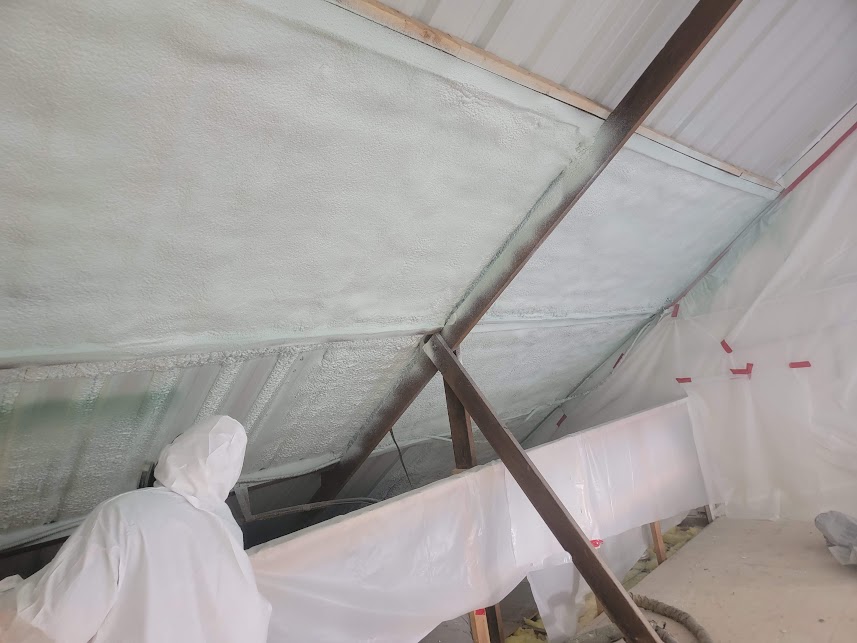  
               Technician applying spray foam insulation on an attic roof.



      
      
      
               