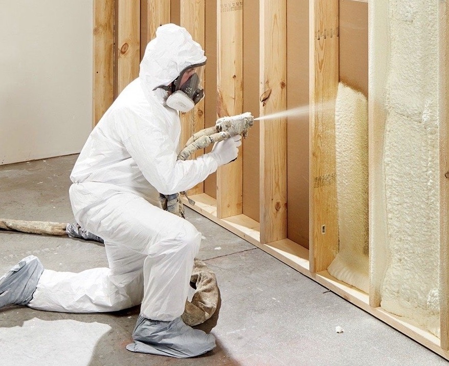  


                     Technician applying spray foam insulation to ceiling and walls.





                     