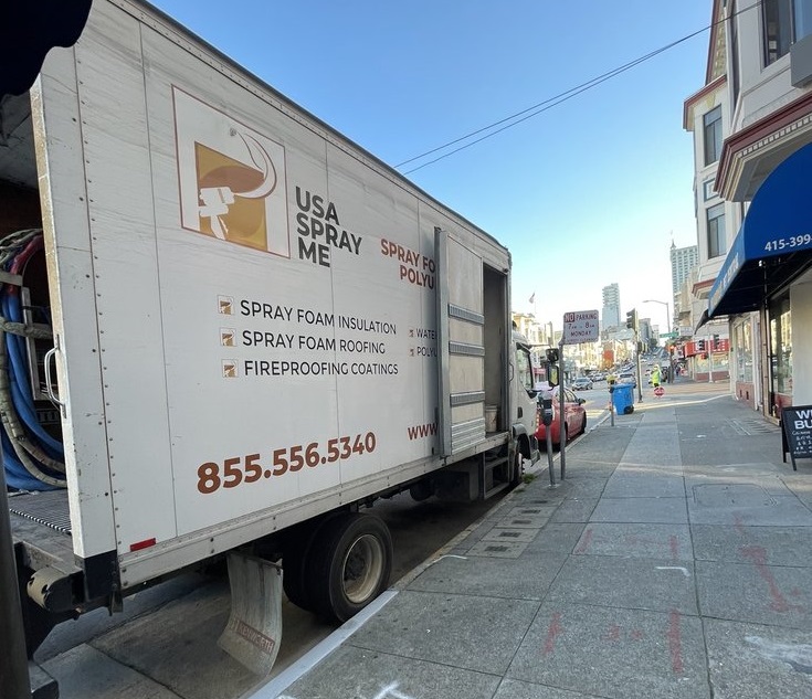 
                   USA Spray Me truck parked on a street, with branding and service details visible.







                  