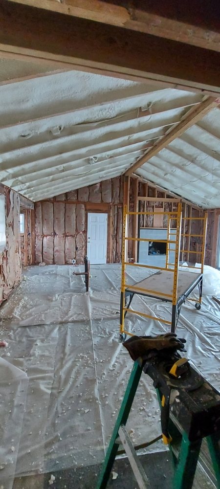  
               
               

               Interior room with spray foam insulation applied to the ceiling and walls.
      
      
      
               