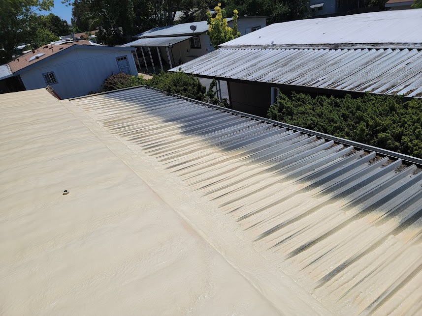  

                     A low-slope roof with spray polyurethane foam insulation application in progress.







                     