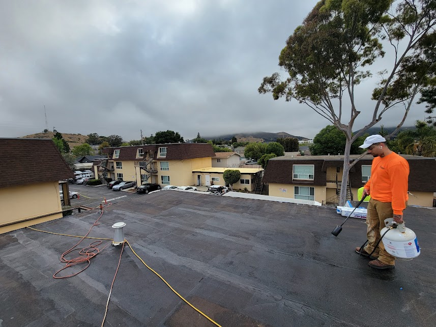  

                   
                  Worker applying SPF insulation to a Fresno roof.



                  