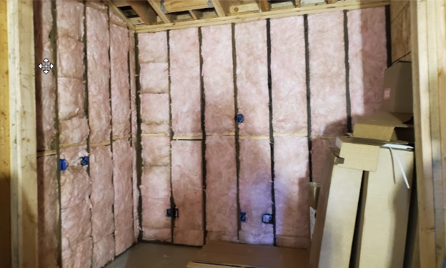  
         
       Fiberglass insulation installed on wooden framing.

         