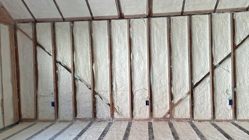  

                    Closed-cell spray foam insulation installed between wooden wall studs in a commercial facility in San Rafael.

                     