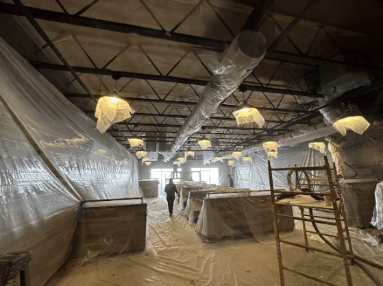 Spray foam insulation being installed in a meat processing plant.