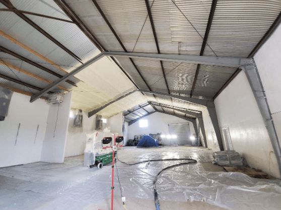 Interior view of a commercial building in San Jose with spray foam insulation on the walls and ceiling.