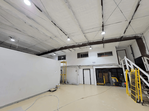 Interior view of a San Jose research lab with spray foam insulation applied to the ceiling, optimizing energy efficiency and moisture control.