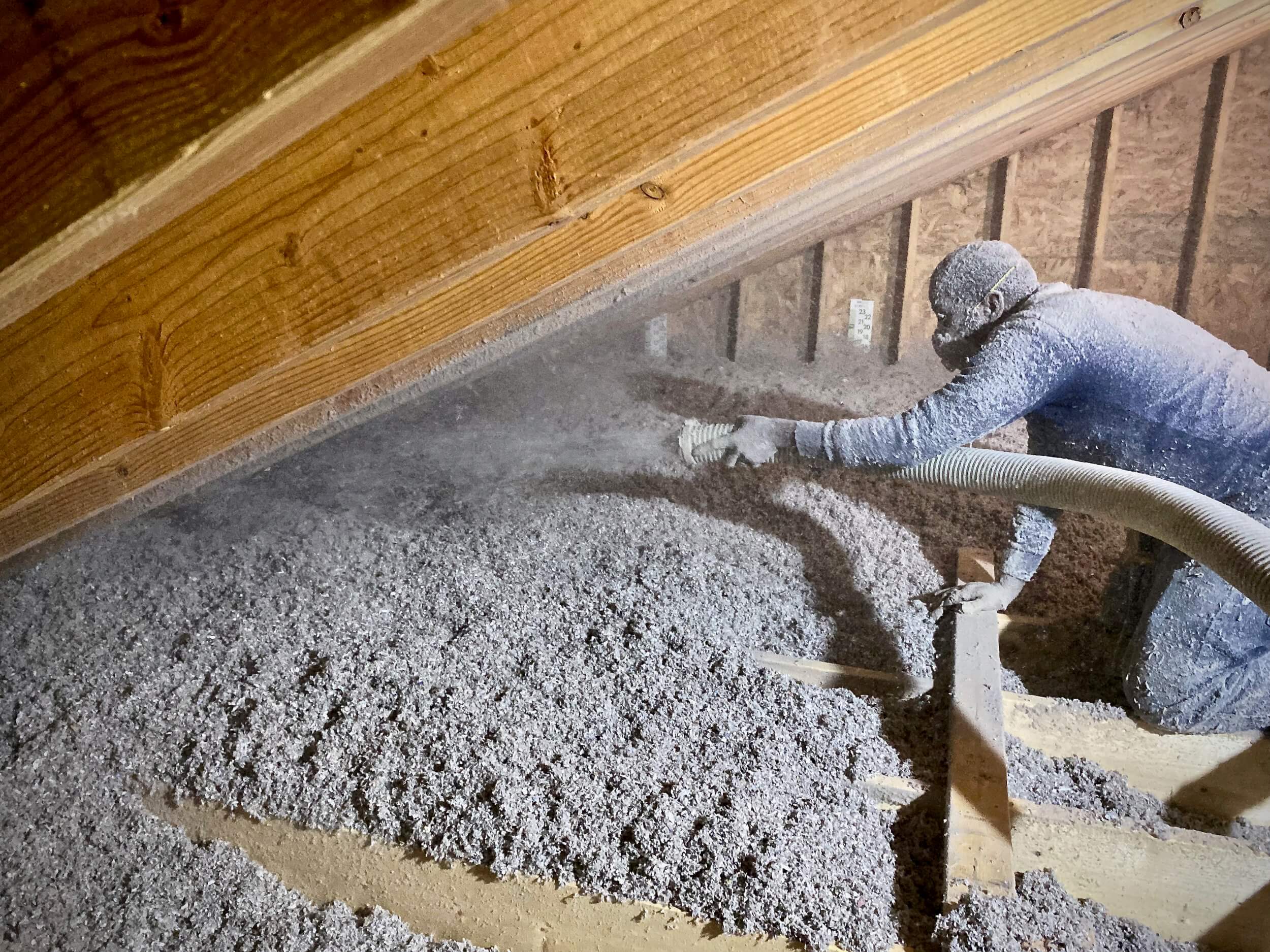  Installation of blown-in cellulose attic insulation. 