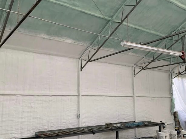 Interior walls with spray foam insulation applied for improved energy efficiency.