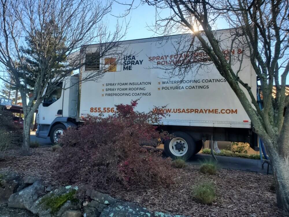 USA Spray Me truck with branding for spray foam insulation and polyurea coatings services.