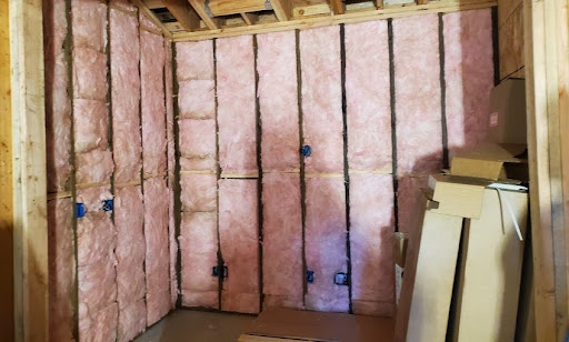  Fiberglass insulation installed between wooden studs in a commercial space in San Rafael. 